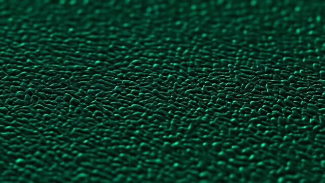 Abstract green textured surface with a bumpy, organic pattern, creating depth.
