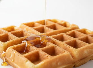 Golden Waffle With Honey Syrup Drizzling Over Crispy Squares, Classic Breakfast Favorite