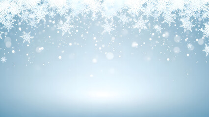 Sparkling snow crystals falling against a soft blue winter background
