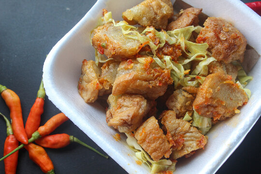 Tahu kocek is a typical snack from Jember, East Java, in the form of hollow fried tofu filled with chewy dough (a mixture of tapioca/starch and flour), then served with spicy onion chili sauce