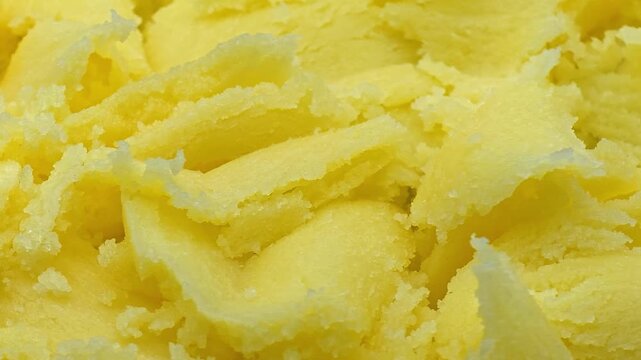 Pure organic ghee or clarified butter highlighting smooth texture for keto diet