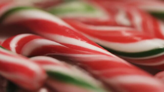 Festive candy canes with red, white, and green stripes, perfect for holiday treats.