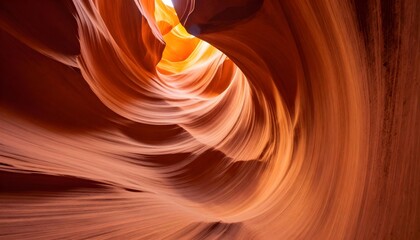 Swirling sandstone formations in Antelope Canyon illuminated by natural light