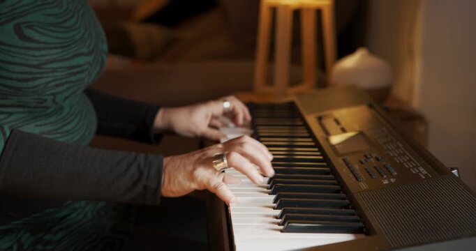 Musical Embrace: An individual's hands gracefully dance across the keys of a synthesizer, lost in the rhythm. It is a moment of pure passion and musical engagement.