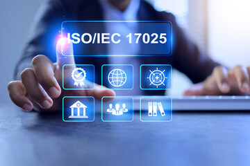 Testing and calibration laboratory management system or ISO IEC 17025 concept with businessman working on desktop to implement work methods compliance regulation and standards requirement