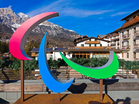 CORTINA D'AMPEZZO, ITALY - JANUARY 22, 2025: Pink and blue Paralympic "Agitos" sculpture in the Italian Dolomites, celebrating the Milano Cortina 2026 Winter Games