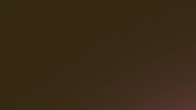 Soft warm brown abstract gradient background with subtle texture.