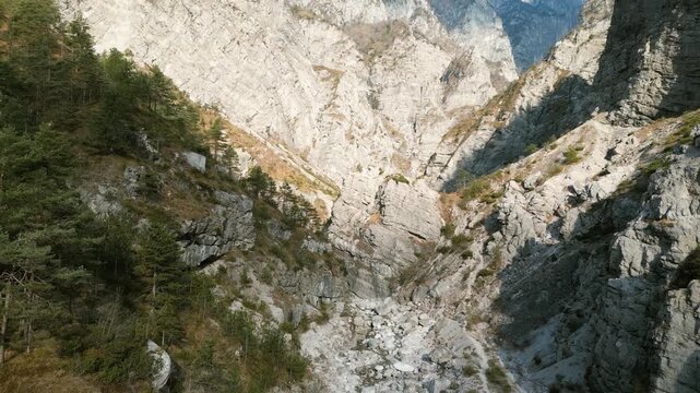 Aerial drone footage over the Susaibes stream near Andreis, Italy: clear water, rocky bed and pristine alpine surroundings. Ideal for nature, travel and scenic stock footage.