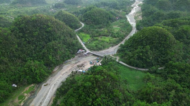 Bridge Across The Pajo River With Lush Tropical Forests Near The Coastline In Virac, Catanduanes, Philippines. Aerial Shot