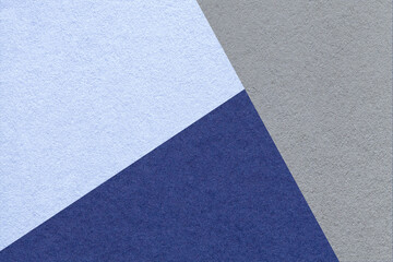 Fototapeta premium Geometric triangular light blue navy gray textured paper background with copy space for banner template