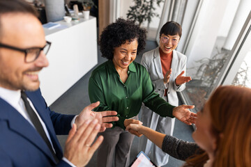 Professional Team Celebrating Together in an Office Environment