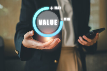 Businesswoman using smartphone with digital value gauge interface, symbolizing data analysis and decision-making in a modern office.