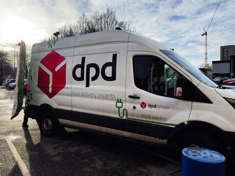 DpD delivery van in a parking lot showcasing 100 percent electric branding and delivery expertise