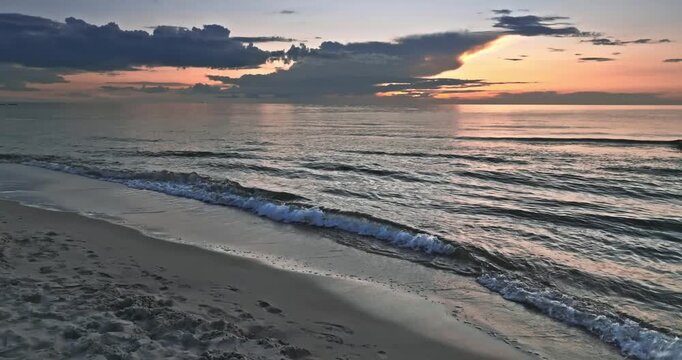 Calm golden sunset over Batlic sea in summer.