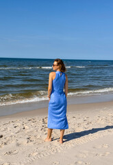 young woman walking on the beach