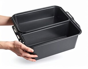Hands Holding A Black Metal Two Compartment Baking Pan Isolated On White Background Studio Shot