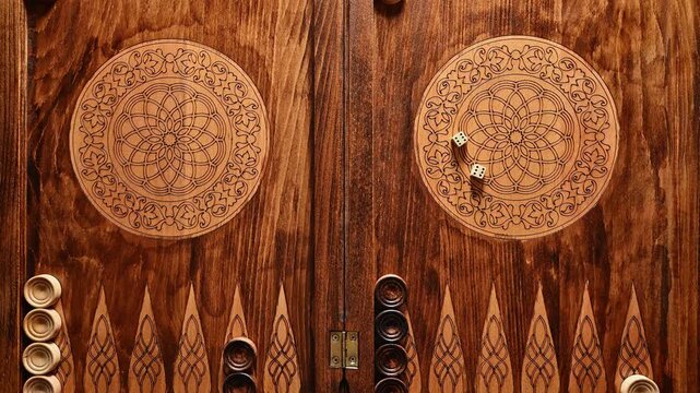 The wooden backgammon with dice and checkers