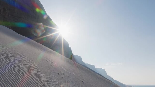A thrilling early morning sandboarding descent on the sandy slopes of Socotra Island, Yemen, with dramatic mountain and coastal views