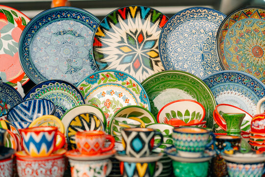 Multi-colored ceramic products with oriental ornaments at the Siab Bazaar in the ancient city of Samarkand in Uzbekistan, Siyob bozor
