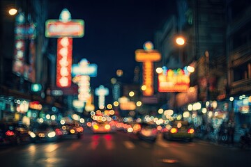 Blurry night street scene with glowing neon signs and traffic lights