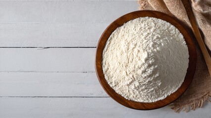 Fresh organic white flour on natural background, flat lay top view