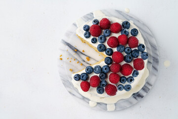 Light Honey Biscuit Cake with White Protein Cream and Fresh Berries, Close Up, top view