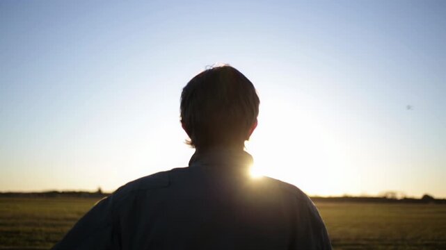 Military Aviator Silhouette Facing Sunrise at Airfield, Argentina - 4K