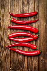 Red Hot Chili Peppers on Wooden Cutting Board, Top View Cooking Concept