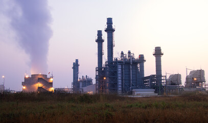 Natural Gas Combined Cycle Power Plant with sunset and light orange