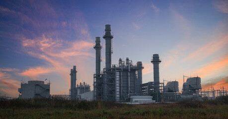 Natural Gas Combined Cycle Power Plant with sunset and light orange