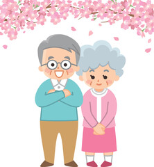 桜と春服を着た老夫婦