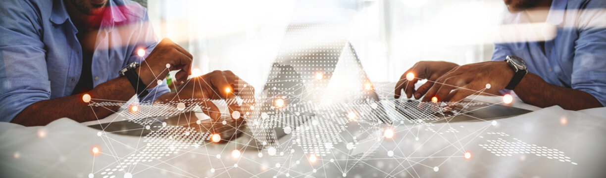 Global Business Networking and Professional Collaboration Concept, Businessman Working on Laptop with Digital World Map and Interconnected Network Overlay.