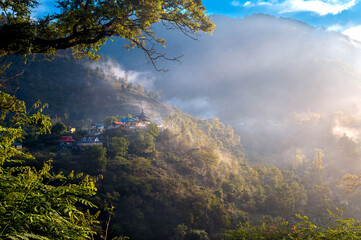 Ethereal Morning Mist over Thadiyar Pawasi Maharaj Temple, Hanol, Uttarakhand. This serene landscape highlights Hindu temple architecture and the tranquil, remote village life of Northern India.  © Kunal
