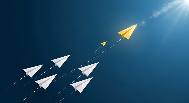 Paper planes soaring through the air with one yellow leader guiding the others in formation against a bright blue sky