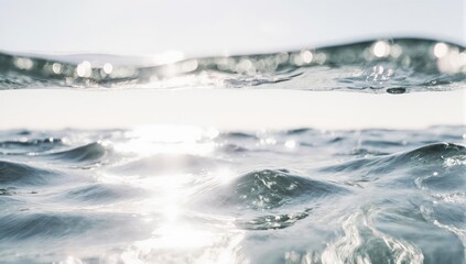 Surface view of water with sun reflecting, slightly blurred focus