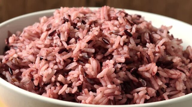 A white bowl filled with riceberry 