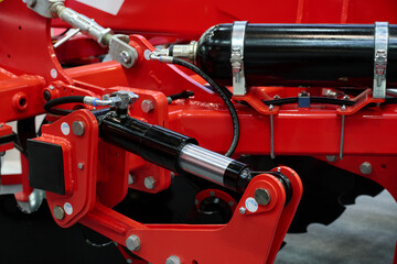 Close-up of hydraulic system control of agricultural plow.
