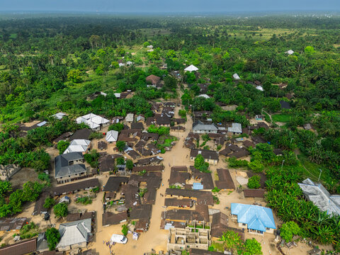 Aerial view of rooftops scattered amongst the lush green trees, a village nestled in nature's embrace, Ubarama, Rivers, Nigeria.