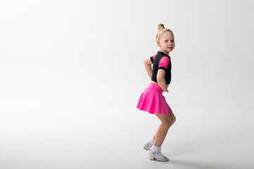 Young dancer with cochlear implant performing expressive sport dance movement. Copy space. Hearing loss rehabilitation, auditory therapy, assistive technology, physical coordination, and confidence