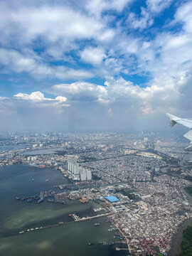 Dense coastal sprawl of North Jakarta shows extreme urban density pressed against the sea, a vulnerable low-lying landscape facing rapid land subsidence and rising tidal risks.