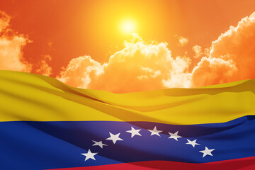 Fototapeta premium Venezuela flag on background of sunset sky. Patriotic concept. Banner with place for text.