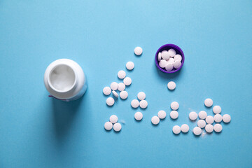 Vitamins for hair, skin and nails on the blue background. Health