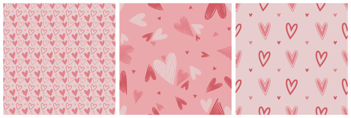 Set of Valentine seamless surface pink patterns with hand drawn hearts. Vector illustration