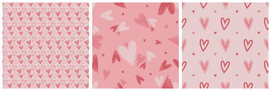 Set of Valentine seamless surface pink patterns with hand drawn hearts. Vector illustration