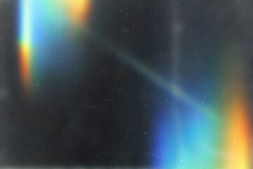 abstract colorful light leaks.grunge film background,retro film overlay effect with scratch dust and ray,Cinematic distressed grain noise worn texture flare on black background,old film burn lens © Cool-Hunter
