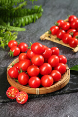 Fresh Tomatoes with Sage and Herbs on Dark Slate