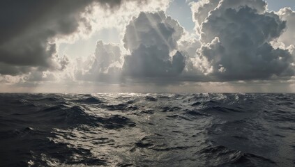 Moody ocean scene under a cloudy sky with sunlight beaming down