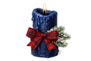 Blue christmas candle burning with plaid bow and frosted pine branch, celebrating holiday season