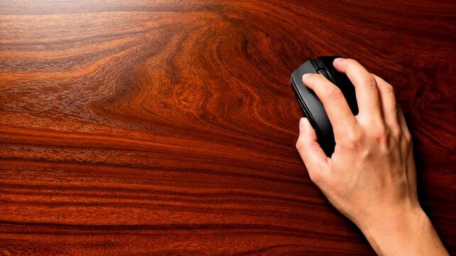 Video, hand holding a computer mouse, PC, office background 