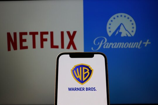 Netflix, Paramount and Warner Bros logos on screens. Media entertainment industry. 